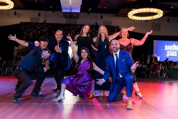 UNITED Tribute alumni dancers pose together after their dance.