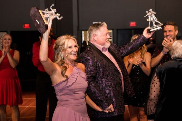 Nancy & Deron celebrate with awards