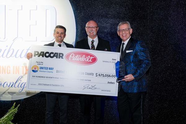 Peterbilt GM presents ceremonial check to UWDC