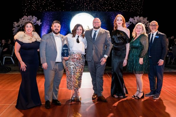 Representatives from Pros PM accept their award